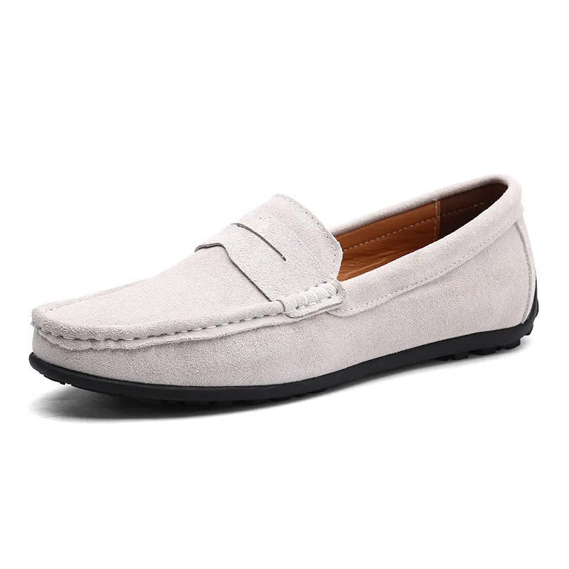 Men's brown suede casual loafers with flat rubber sole and round toe on a white background