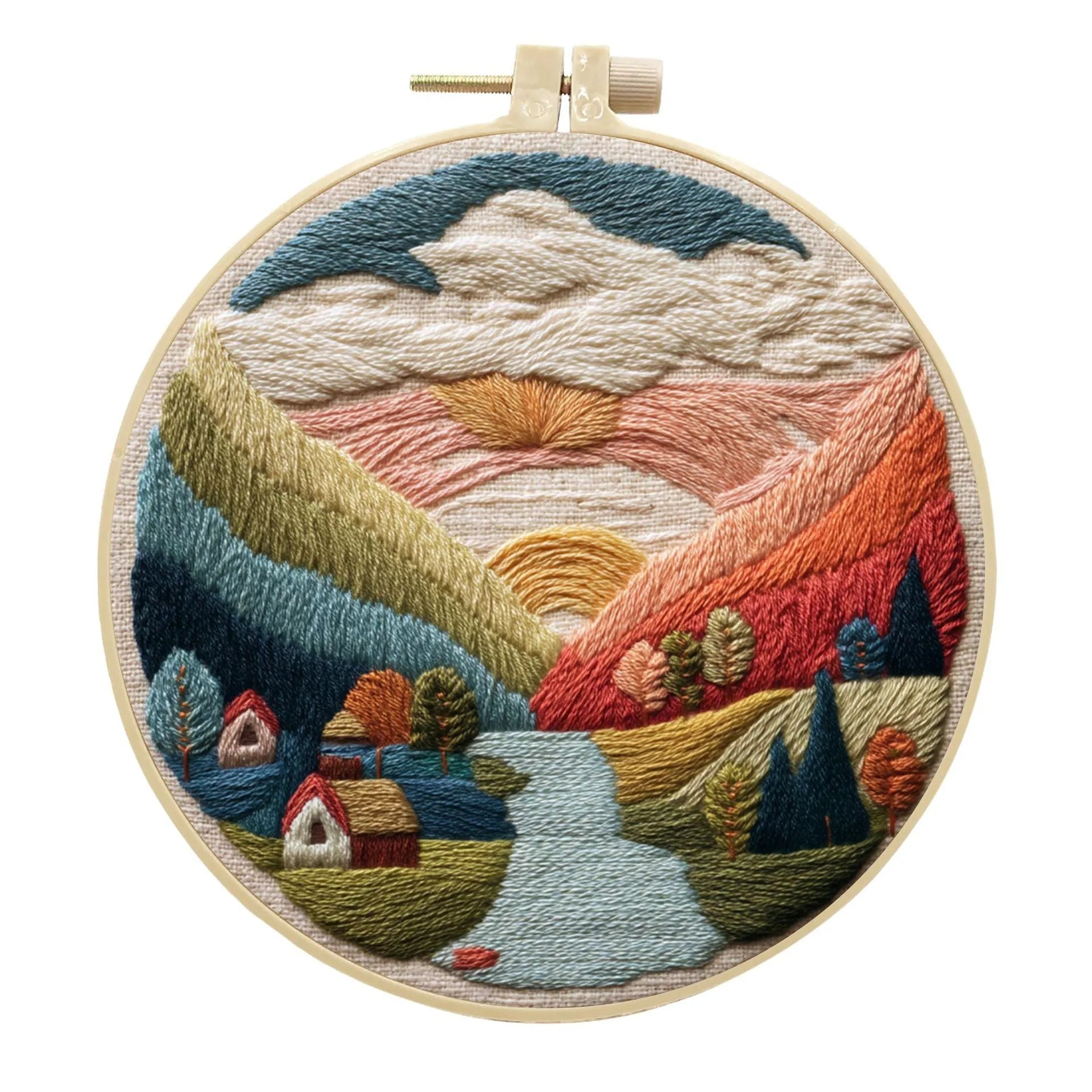 Embroidery DIY kit with bamboo frame, cotton fabric printed with a landscape scene, threads, and needles laid out