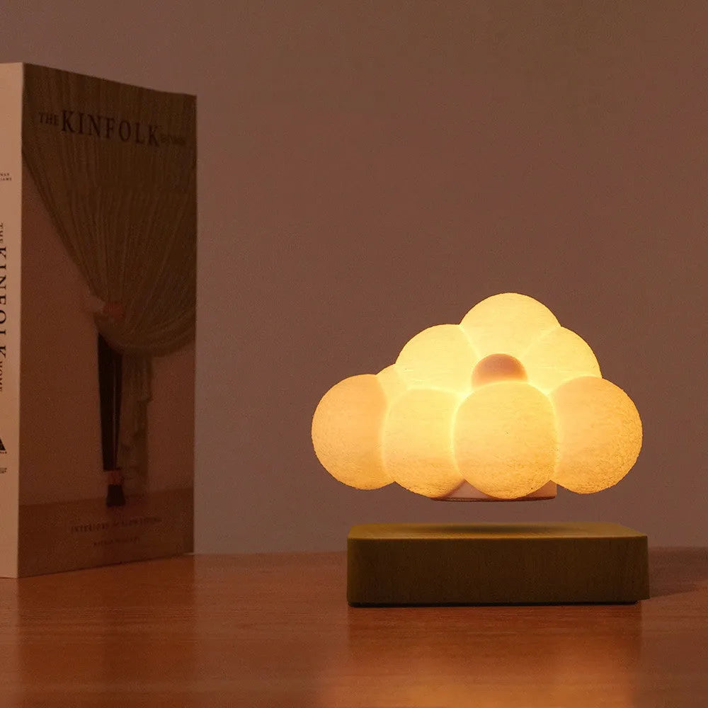 Magnetic levitation cloud night light with 3D printed cloud floating above base, warm white light