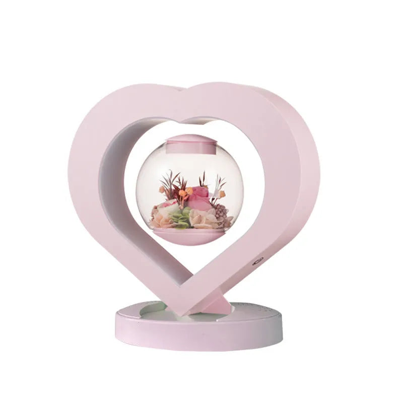 Pink preserved rose decorative ornament with optional Bluetooth-enabled base for playing music