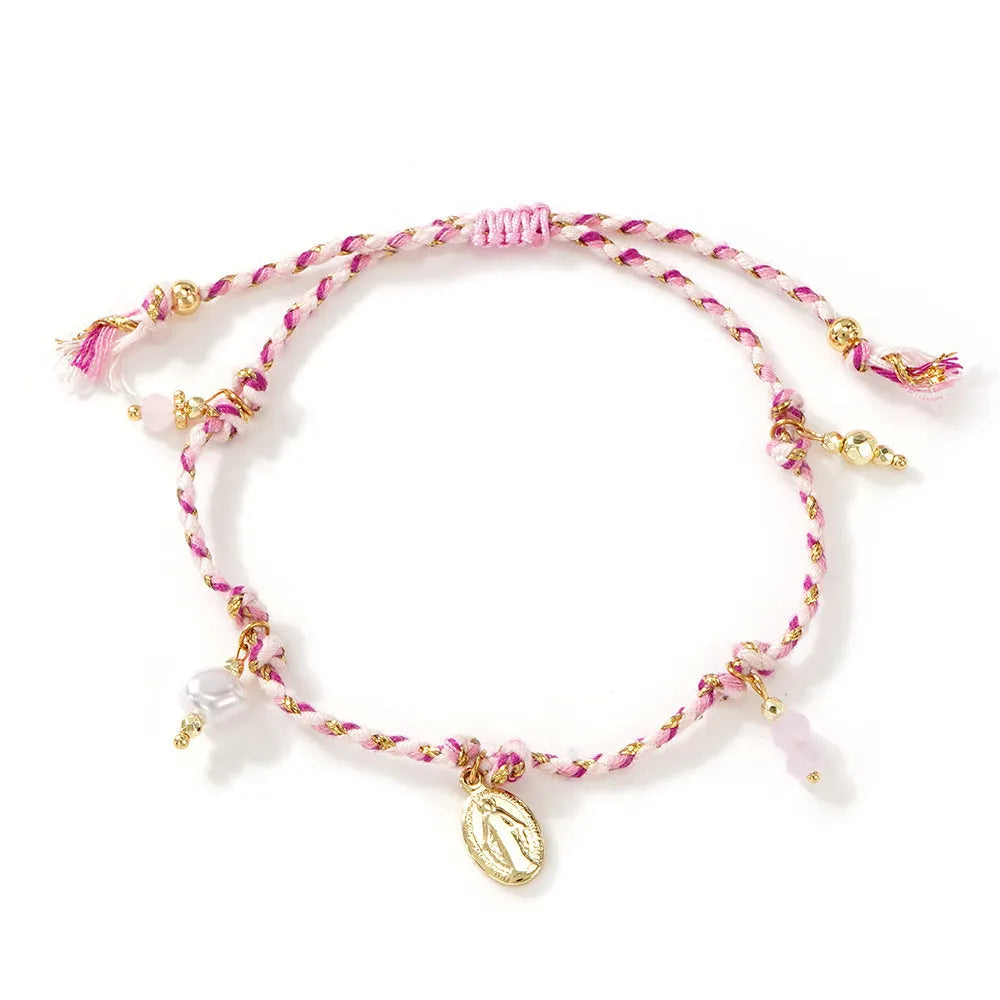 Close-up of a hand-woven colourful braided rope bracelet for women, showing textured ethnic style.