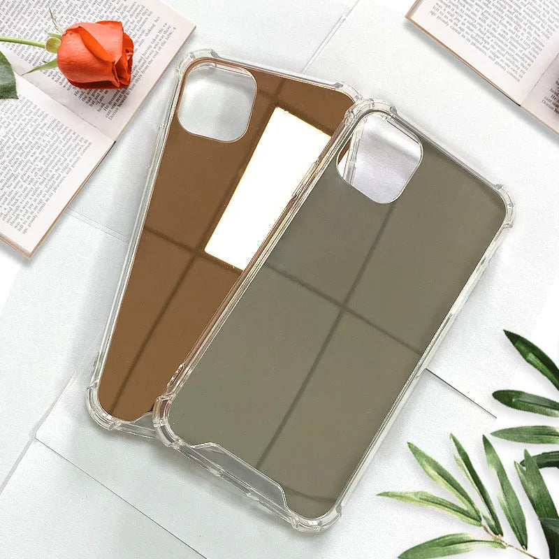 Silver mirror finish hard PC phone case for Apple iPhone on a table.