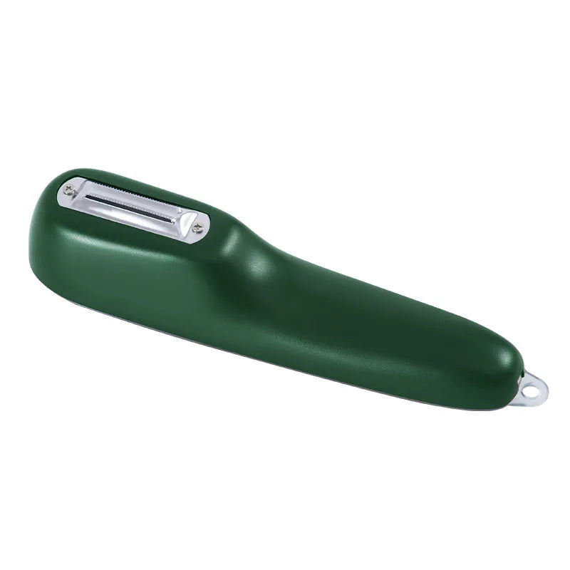 Dark green vegetable peeler with a storage tube and a stainless steel blade on a kitchen worktop.