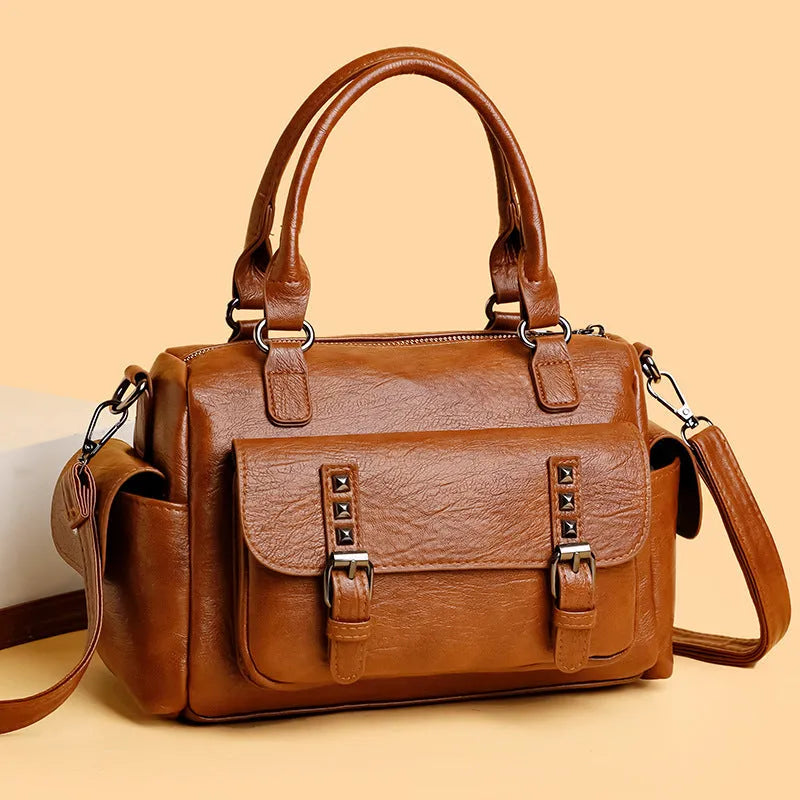 Vintage-style large square messenger bag in PU leather with contrast stitching.