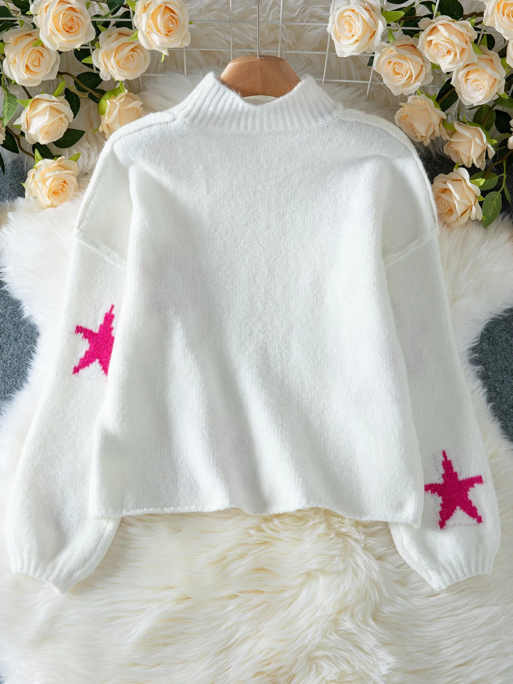 White women's loose turtleneck pullover sweater with five-pointed star pattern and contrast detailing