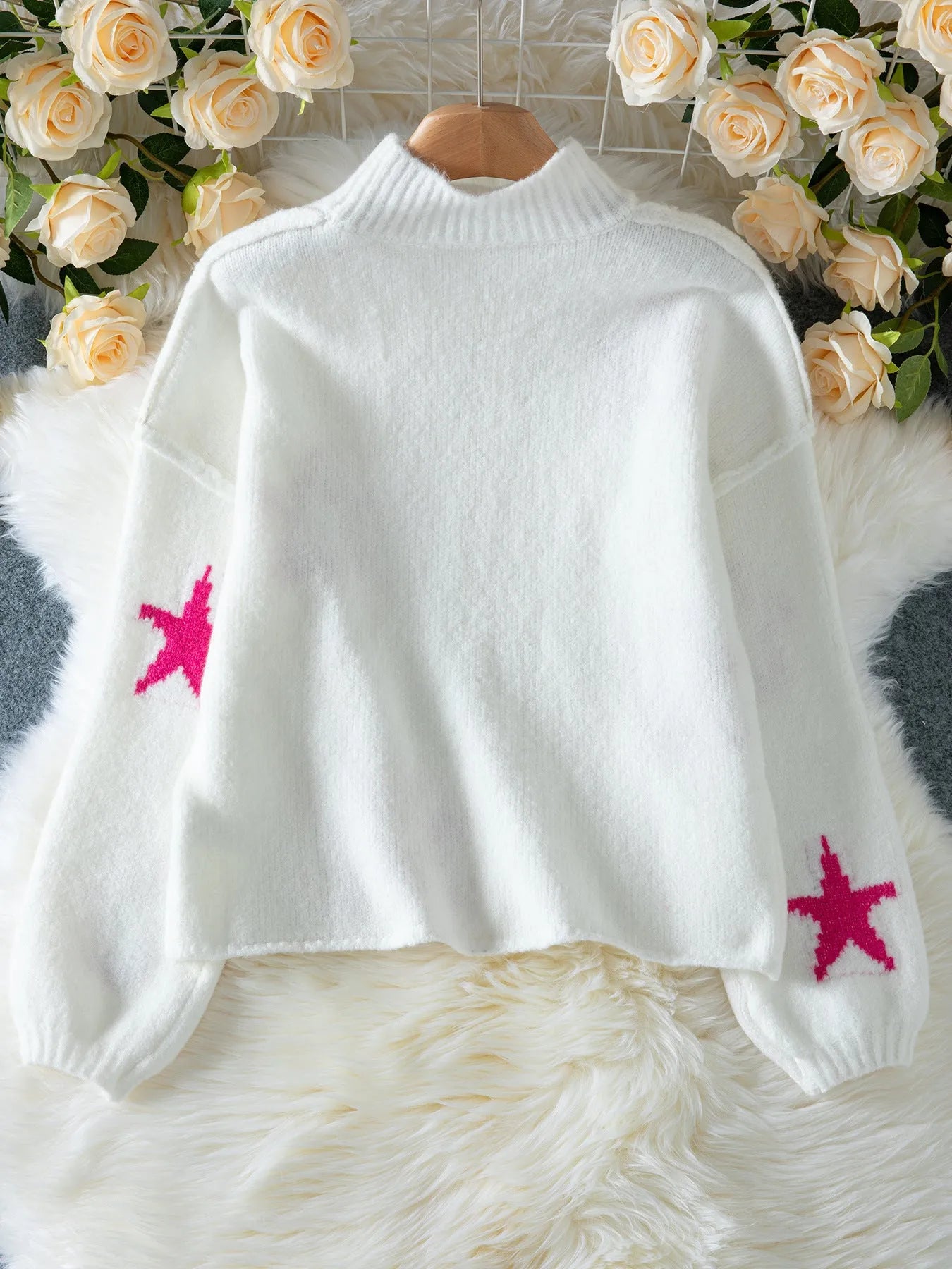 White women's loose turtleneck pullover sweater with five-pointed star pattern and contrast detailing