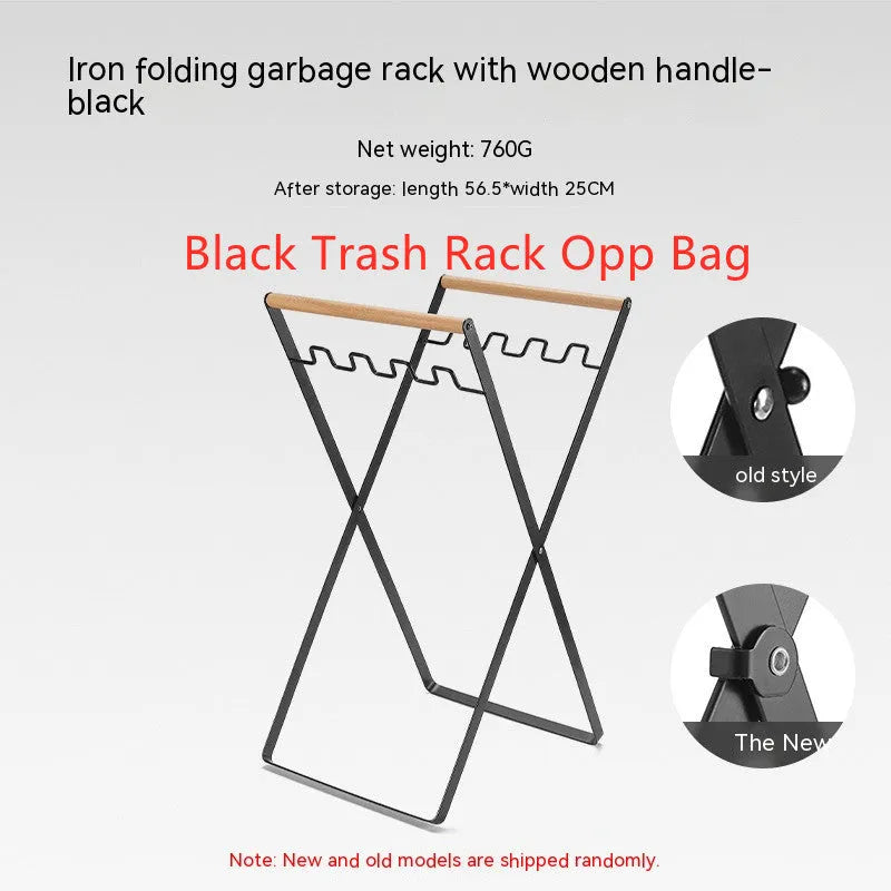 Black outdoor folding iron trash rack with a wooden handle, holding a bin bag.