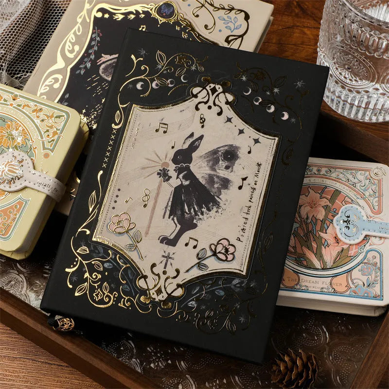 THALO A5 gothic retro art notebook showing three cover design options on wooden surface