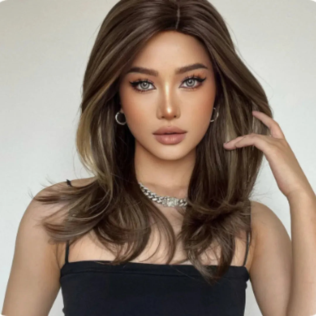 Mid-length synthetic wig with long curly hair, fringe, and platinum gradient colours