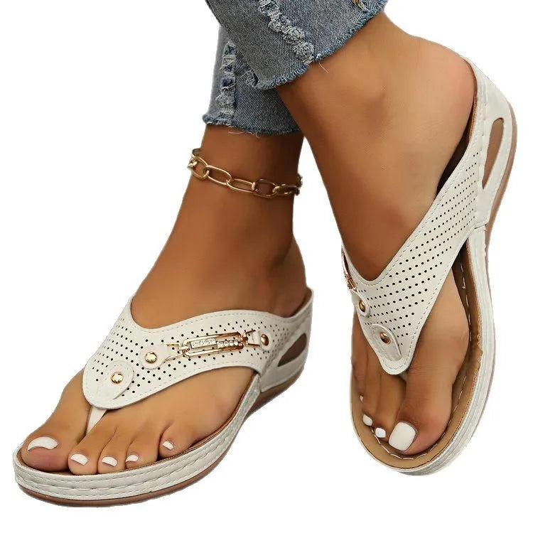Women's beige retro flip flops showing herringbone patterned footbed and strap.