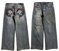 Grey washed-out wide-leg straight jeans on a mid-waist mannequin, showing zipper fly and relaxed fit.