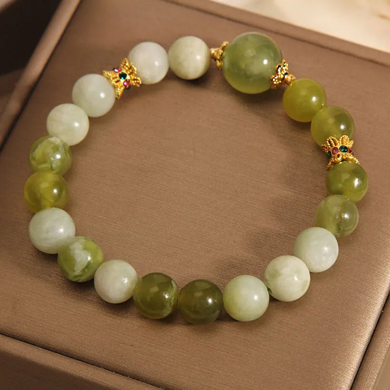 Women's bracelet made of green Xiuyan jade in an original sweet Mori style design.