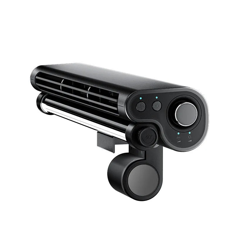 Black bladeless USB fan with light clipped to top of a laptop screen.