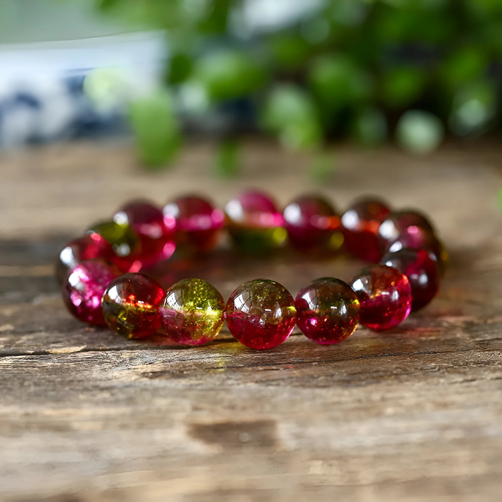 Women's handmade watermelon crystal bracelet showing pastoral design elements on wrist