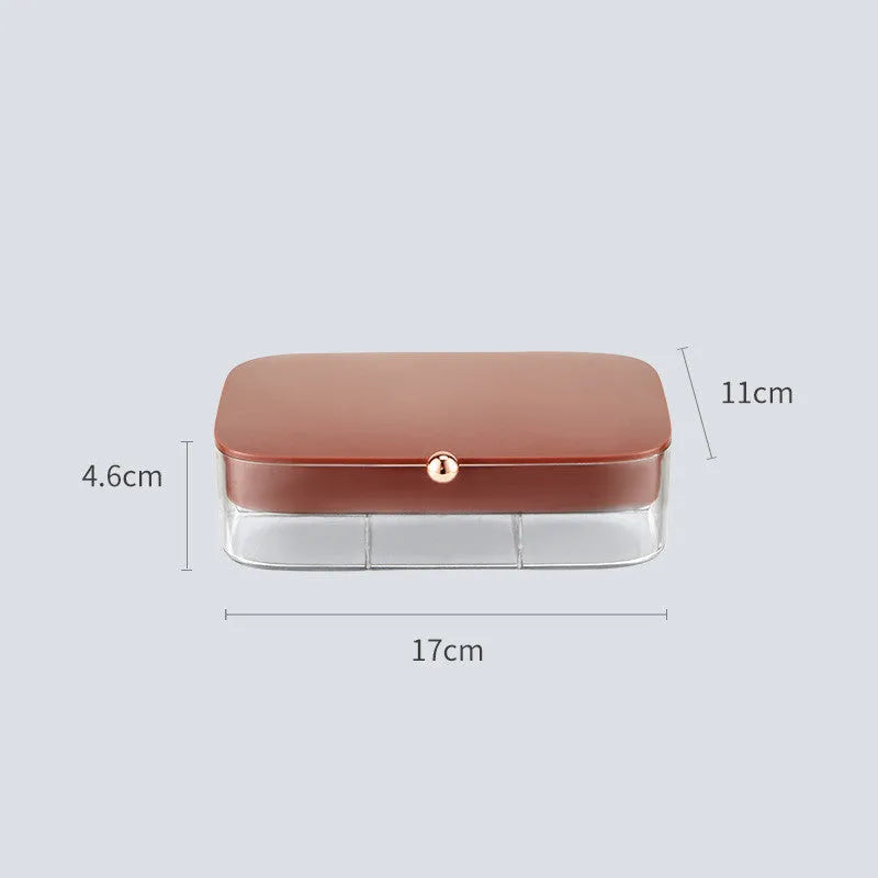 Green minimalist jewellery storage box with multiple internal compartments for rings and earrings.