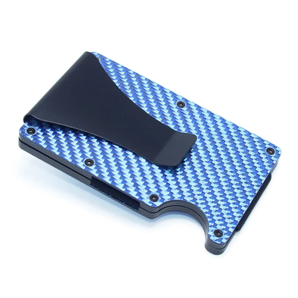 Slim black carbon fibre card holder wallet with geometric design on a table.
