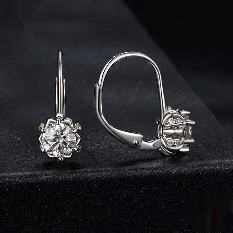 White gold plated sterling silver flower ear clip with moissanite centrepiece.