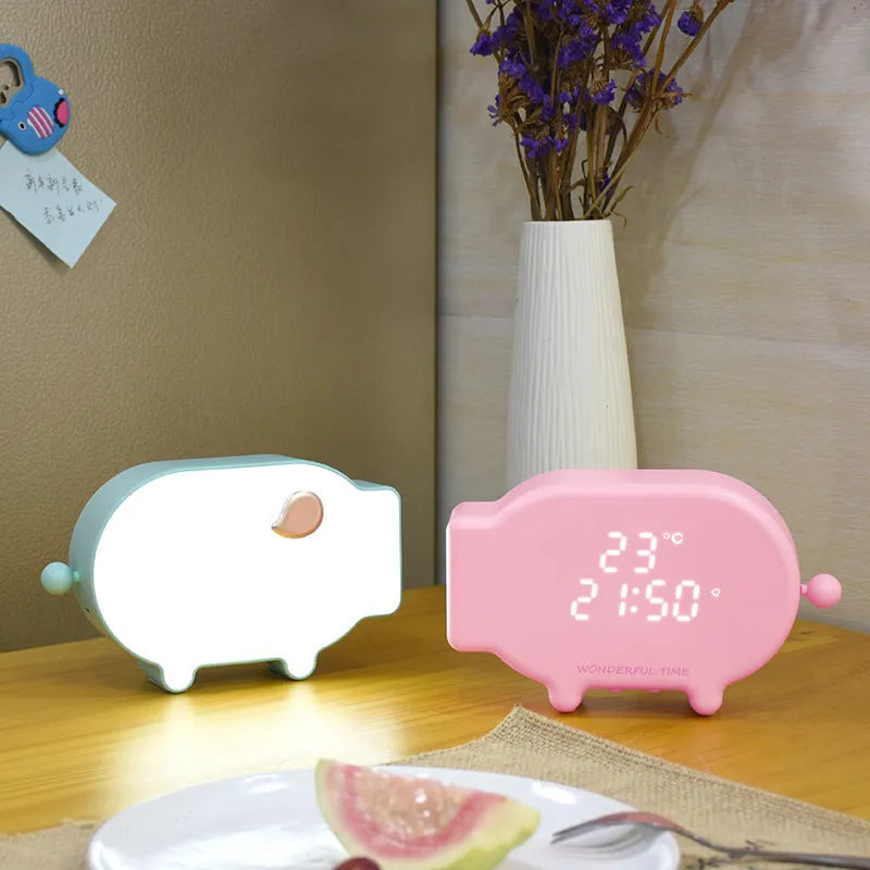 Blue and pink multifunctional LED alarm clock showing time and temperature with USB charging port