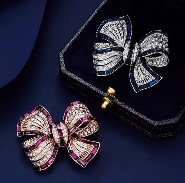 Alloy bow brooch in purplish red, blue, and purple colours for women