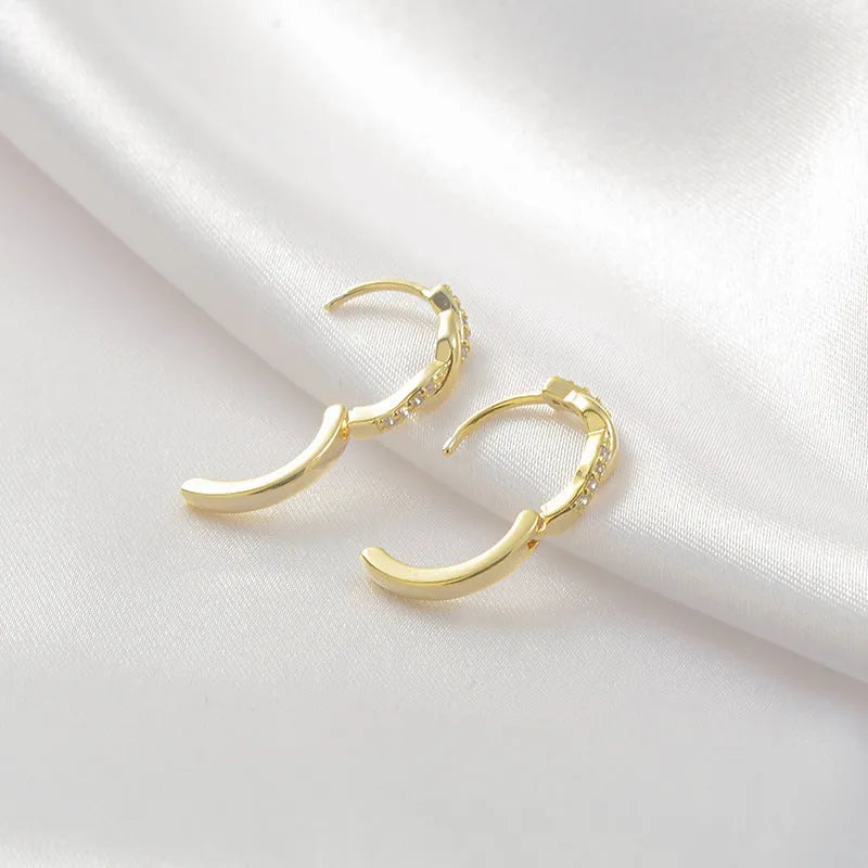 Geometric interwoven hemp rope earclip earrings for women in gold and silver colour options.