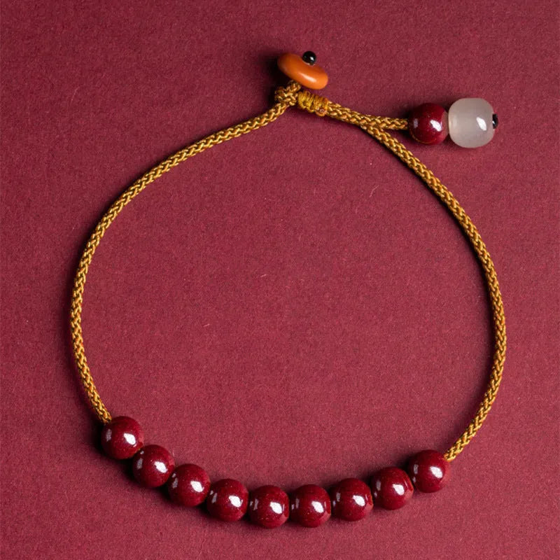 Cinnabar and Hetian jade bracelet with geometric beads on adjustable hand-woven cord
