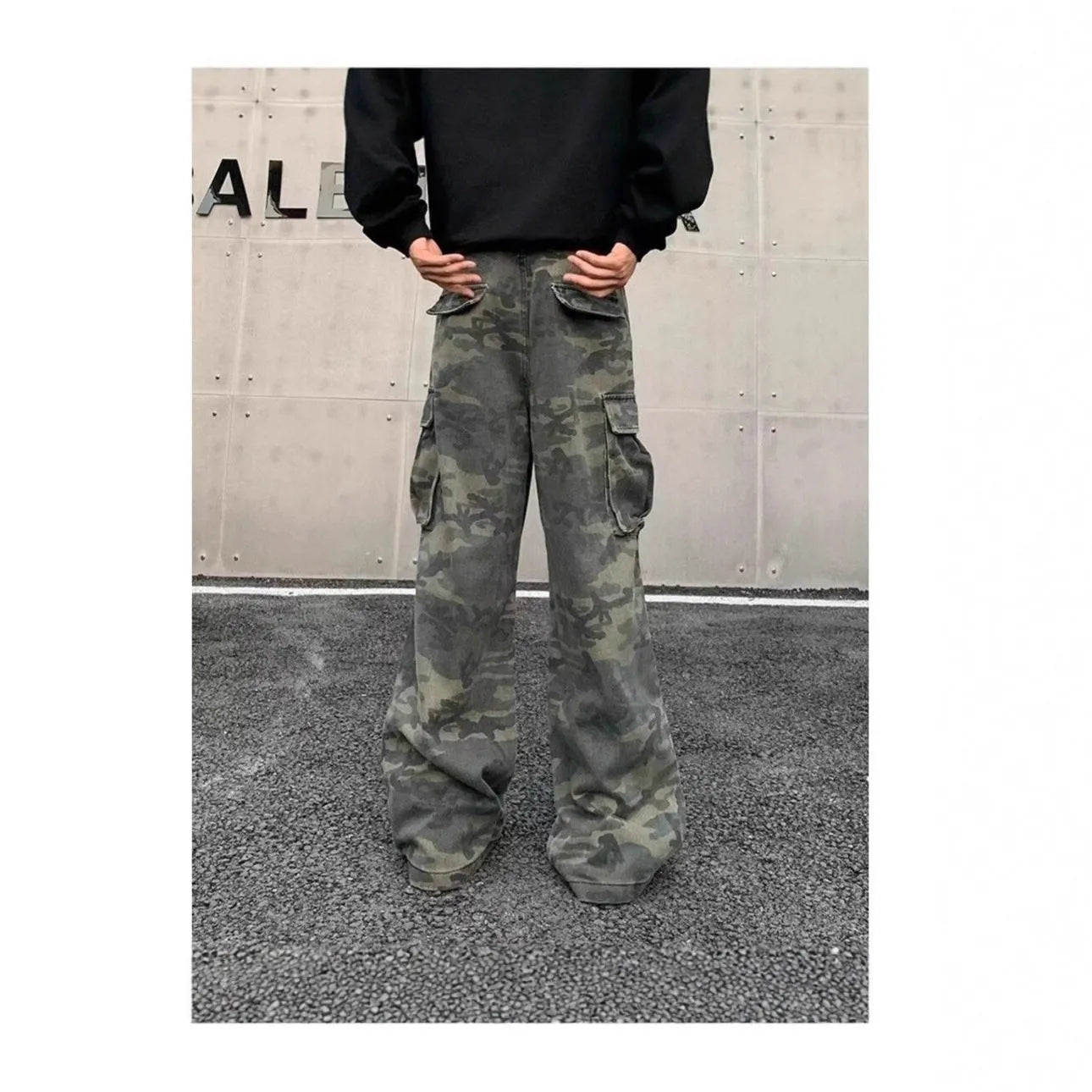 Korean style washed camouflage cargo trousers on a hanger, showing multiple pockets and mid waist design.