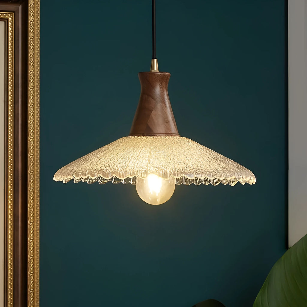 Wood and brass ceiling chandelier with glass lampshade in three available sizes.