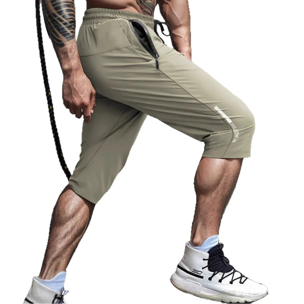 Men's cropped nylon sports trousers in straight cut available in black, blue, gray and khaki