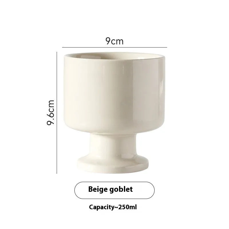 Hand-pinched irregular ceramic mug in solid colour, approximately 250ml capacity