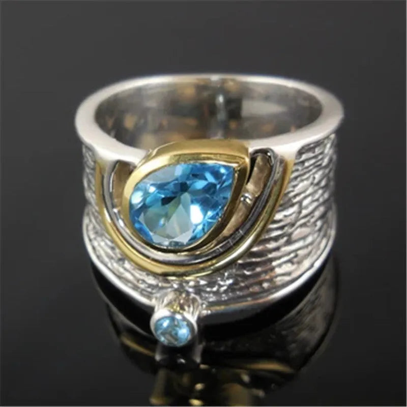 Blue zircon inlaid women's ring with Chinese style design and drop shape on alloy band