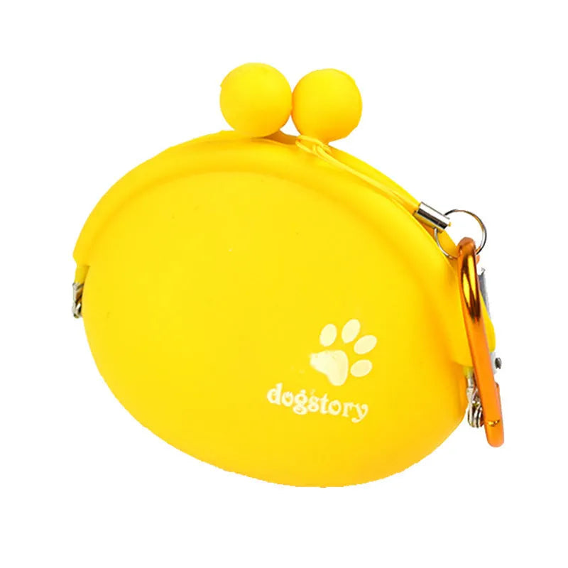 Yellow silicone dog treat pouch with hook-and-loop closure on a waist belt