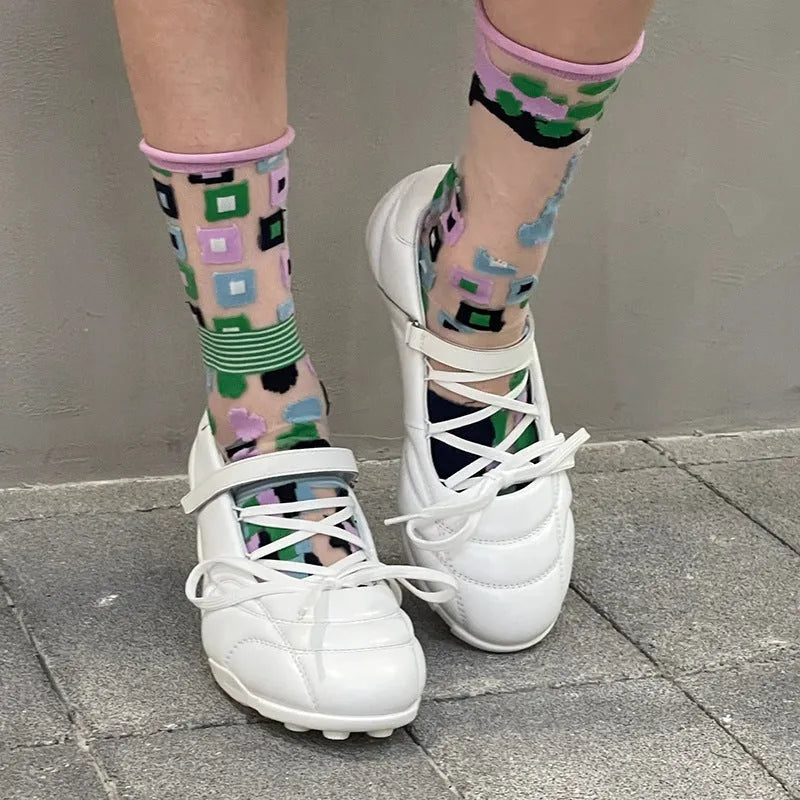 Women's silver lace-up bow sports shoes with mid heel and round toe on white background