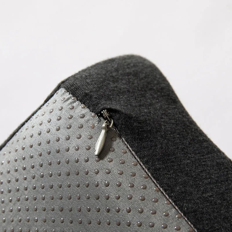 Black memory foam office chair cushion with a solid colour polyester cover, shown on a chair seat.