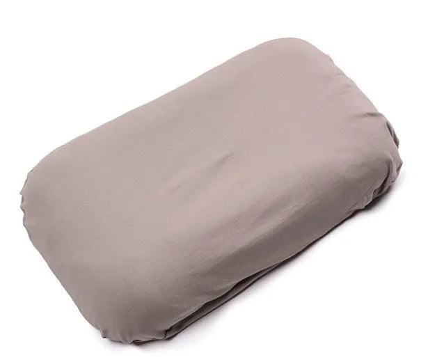 Beige portable baby nest crib for newborns measuring 75cm by 45cm on a neutral background.