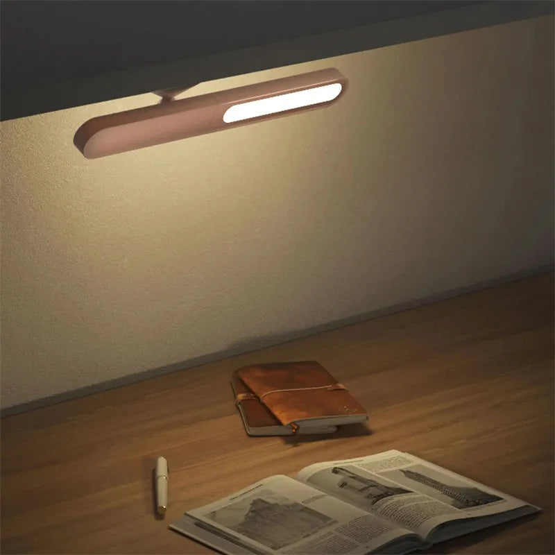 Geometric wireless table lamp with magnetic suction on metal surface showing USB connection