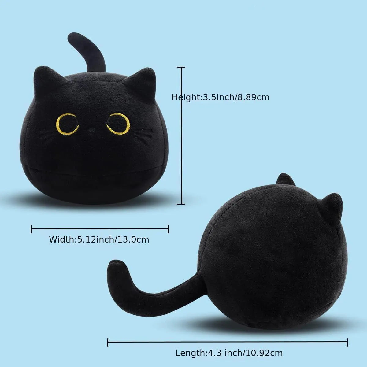 Black cat plush toy stuffed animal sitting as a soft pillow cushion on a sofa.