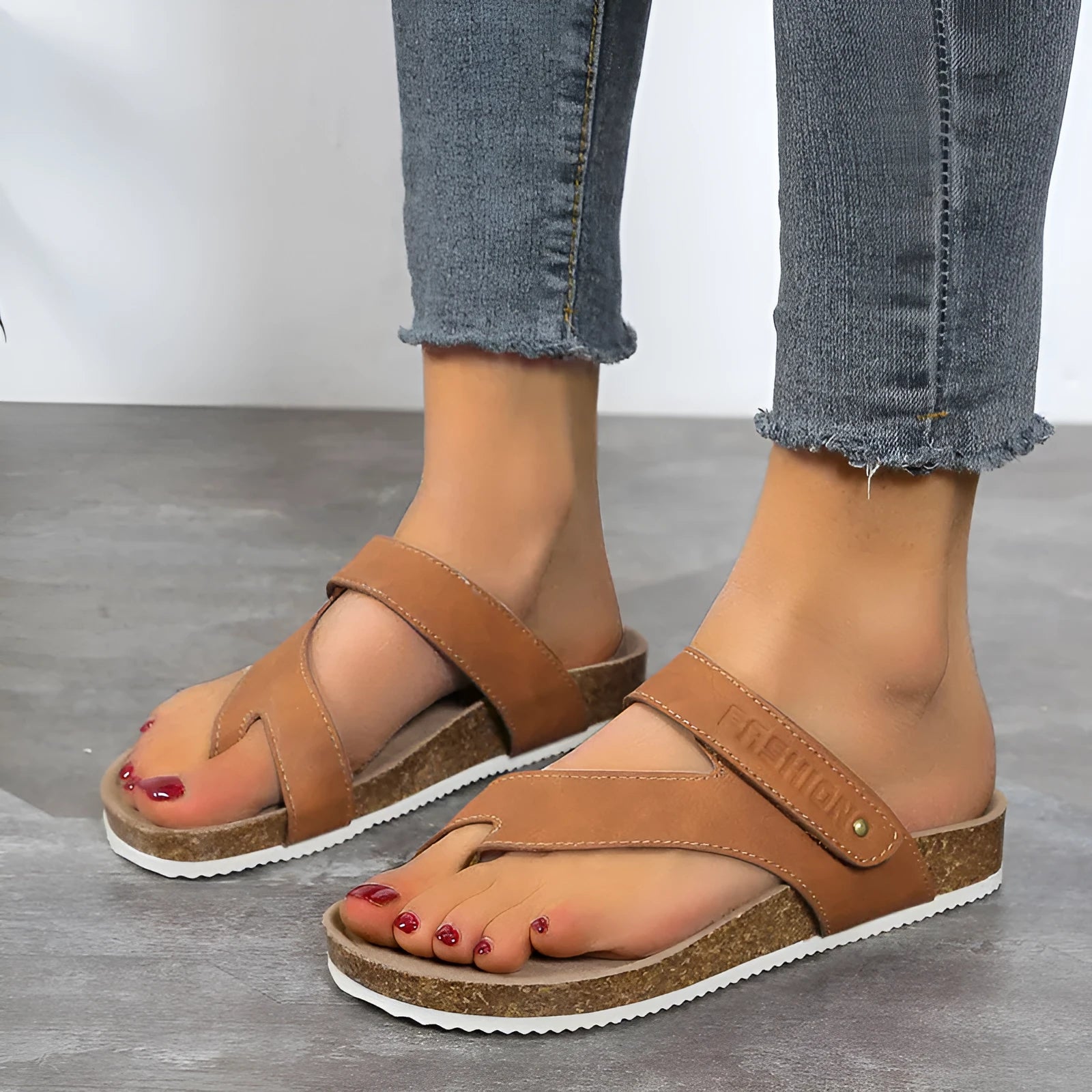 Flat toe ring flip-flops with a thick foam sole in a solid colour, shown in blue.
