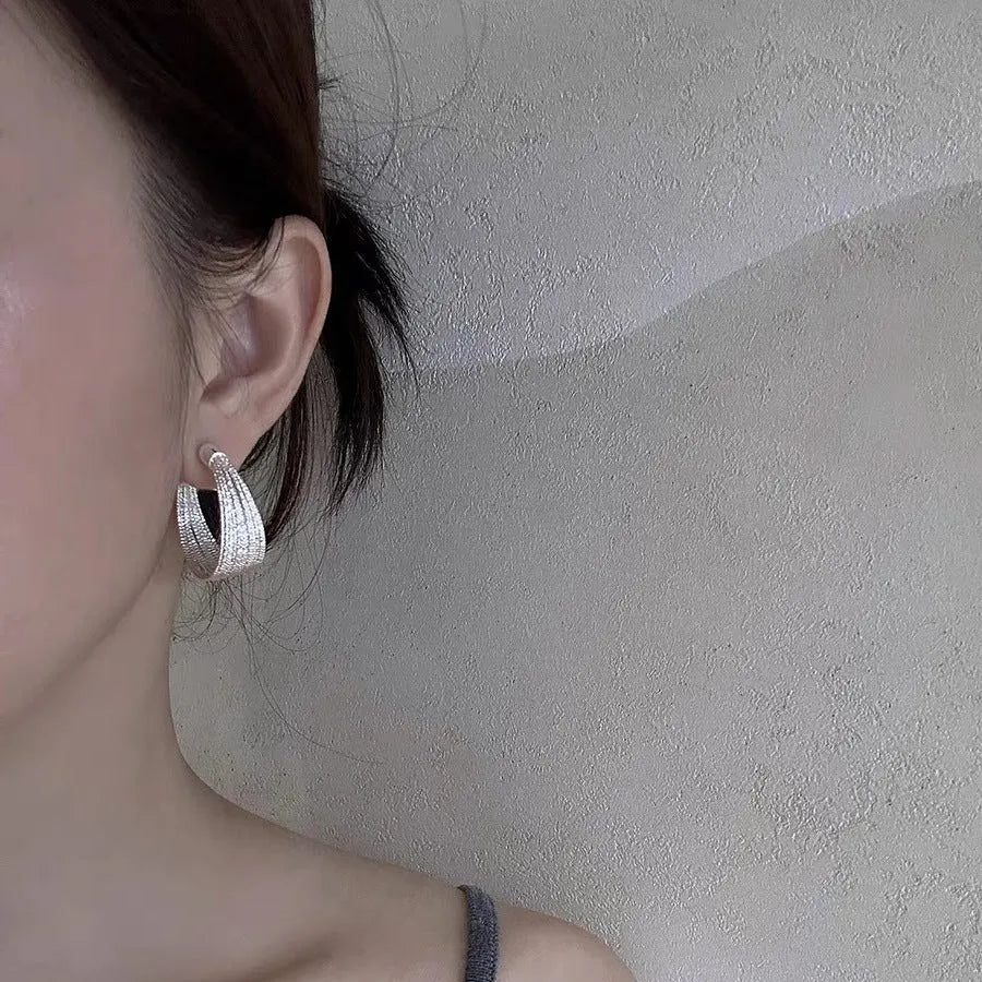 Geometric multi-layer simple bracelet earrings in gold and silver finishes with copper construction