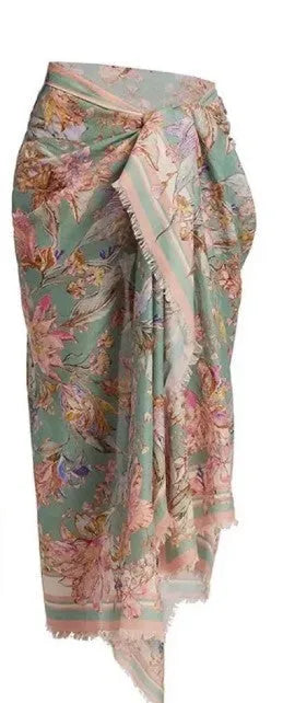 Women's floral bikini swimsuit set with skirt in creamy-white colour, showing top, briefs, and cover-up components