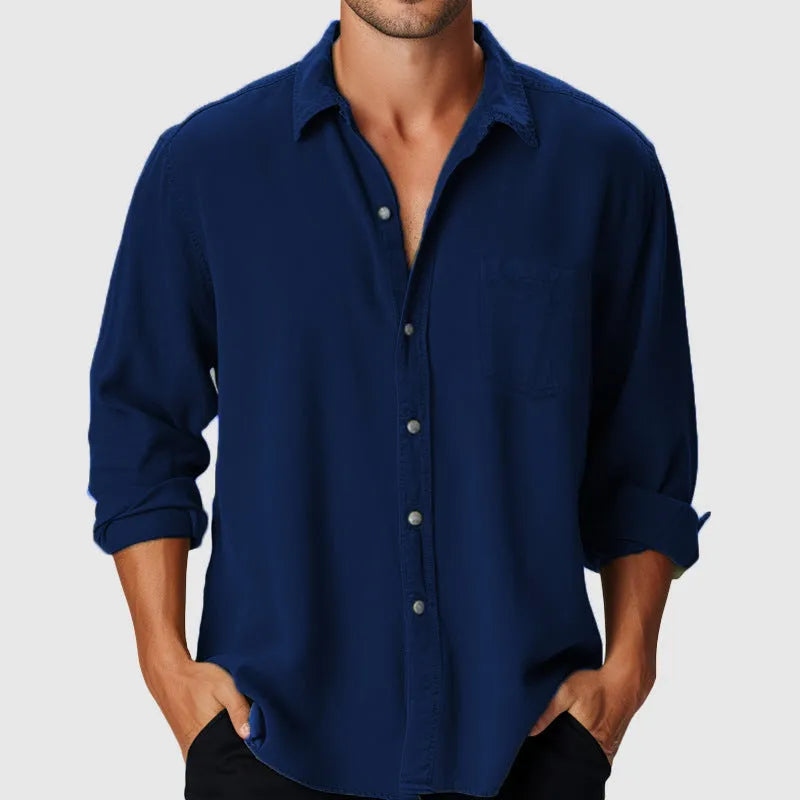 A man's loose-fitting long sleeve beach shirt with a stand collar, shown in a solid colour.
