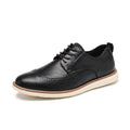 Men's black slip-on business casual shoes with decorative carving details on PU leather upper