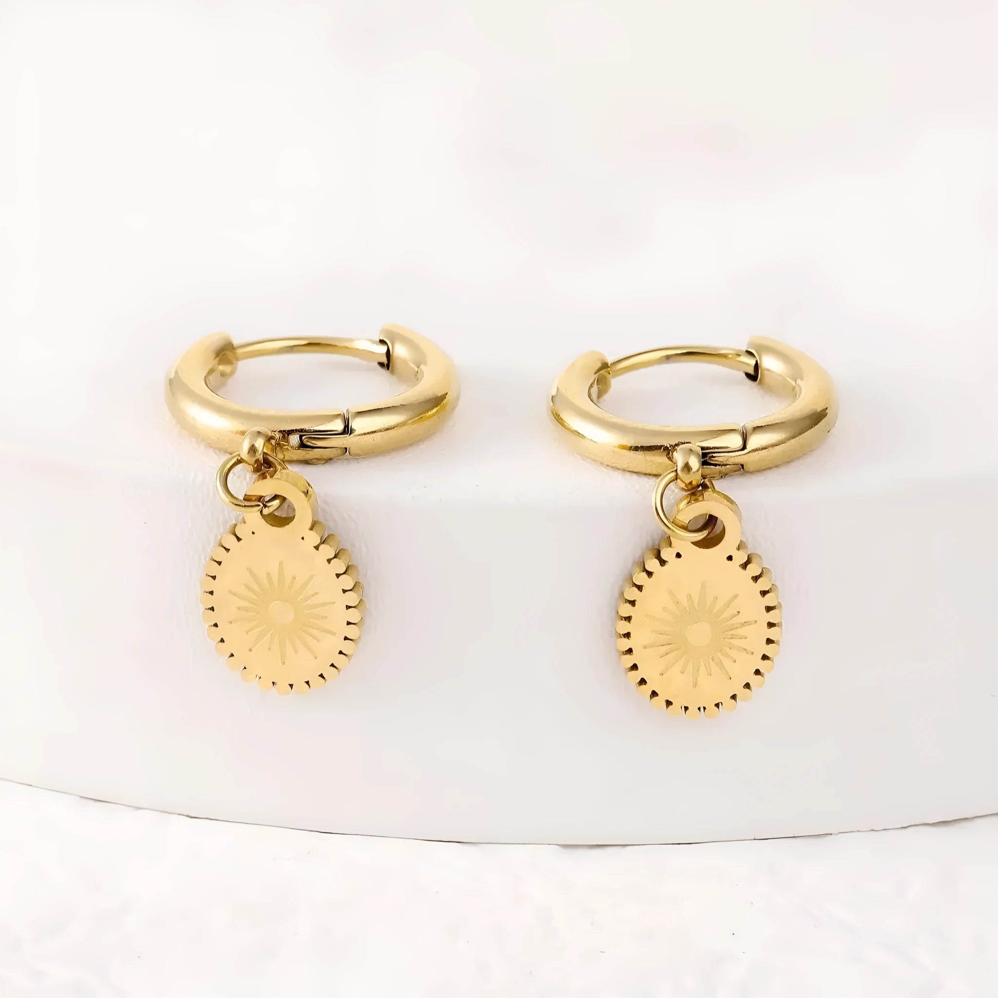 A pair of women's stainless steel geometric ellipse ear studs in colour XY-EH005.