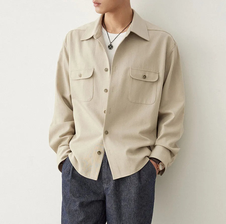 Men's light sand rice coloured long sleeve shirt with a simple lapel and collage stitching.