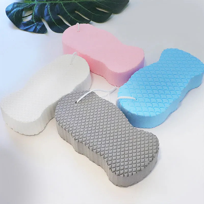 3D fish scale pattern bath sponge ball in white, grey, pink, or light blue colour.