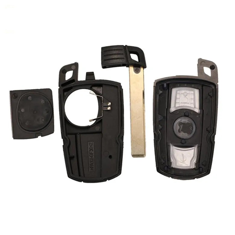 BMW CAS3 semi-intelligent remote car key fob with three blank metal blades attached.