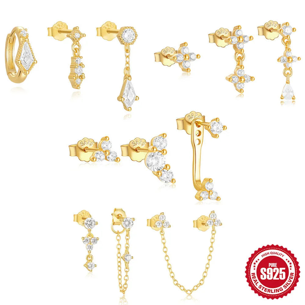 Three pairs of geometric sterling silver earrings with zircon stone accents in gold colour variations