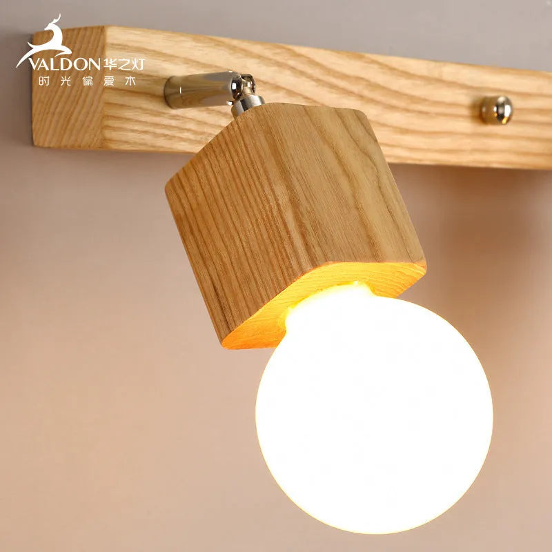 24cm round mirror finish LED wall lamp with a single light head for vanity lighting.