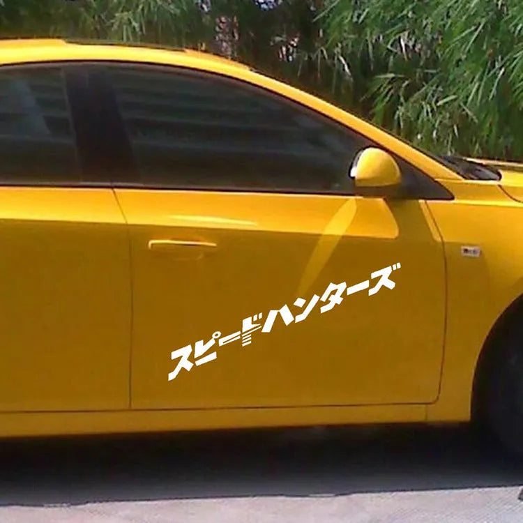 Black and white reflective Japanese car sticker measuring 35x35cm on a vehicle window.