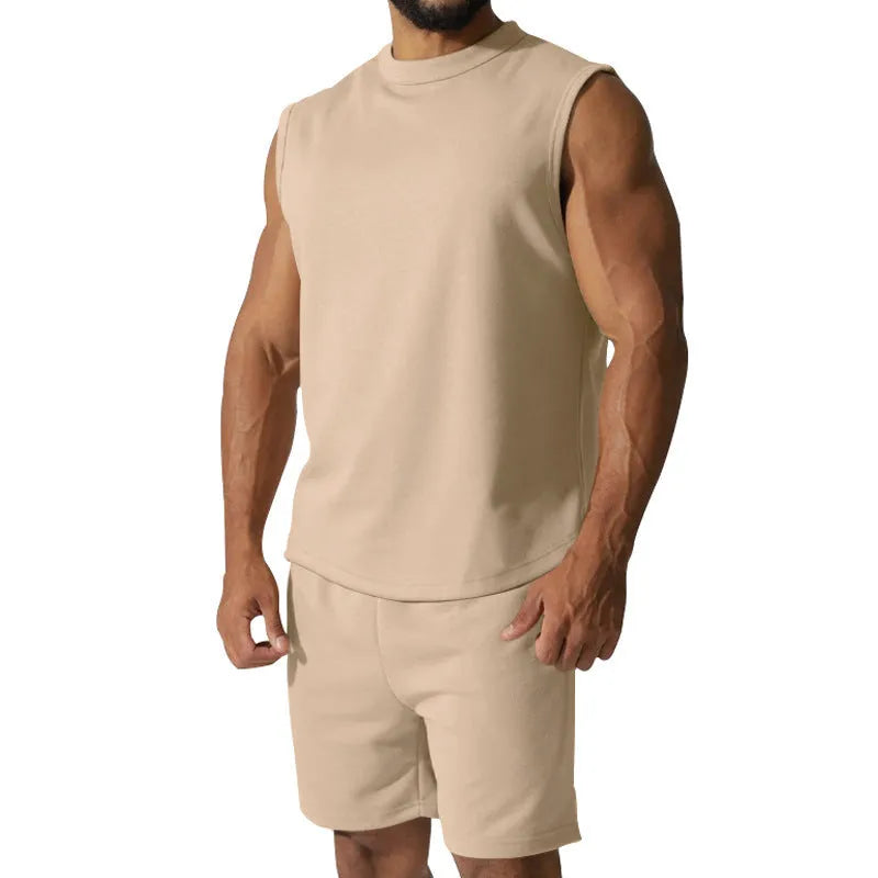 Men's sleeveless cotton blend sports suit showing sleeveless top and matching shorts in a solid colour.