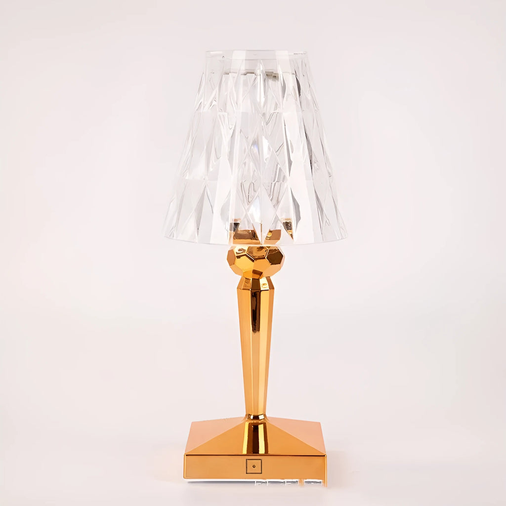Rose gold portable touch control night light with dimming settings on a surface.